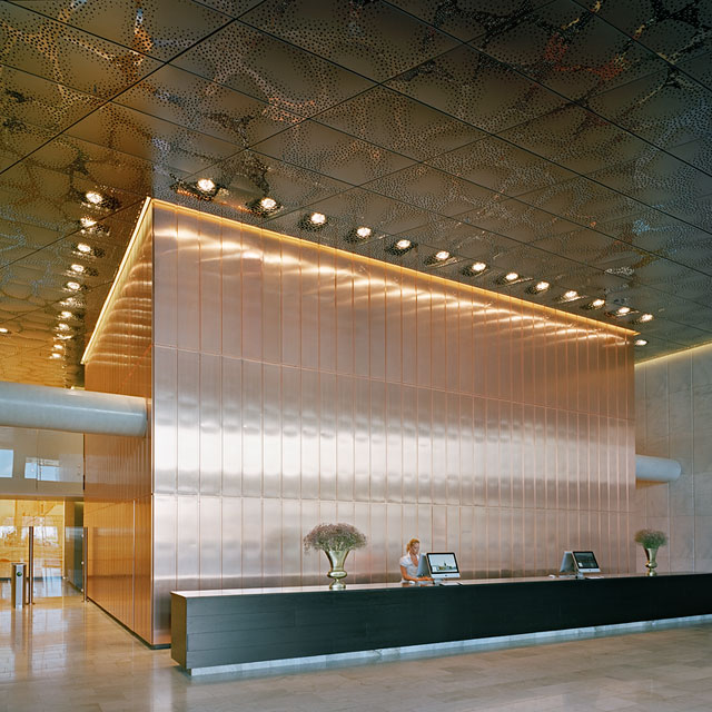 Stockholm, Waterfront Building, Reception Hall, Stainless Steel Ceiling and Copper Wall, Grid Ceiling, Panels Type EXYD-F with Pattern Perforation, Photo Michael Perlmutter