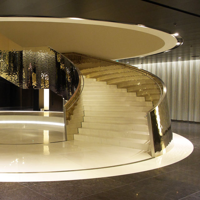 Vienna, Hotel Melia Vienna in DC Tower 1, Entrance Hall with Self-Supporting Spiral Stair, Interior Work SFL, Cladding EXYD-M, Photo EXYD